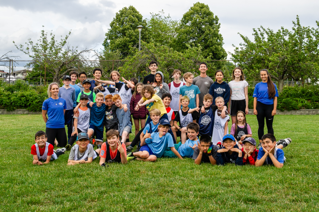 kids and adults posing for a photo
