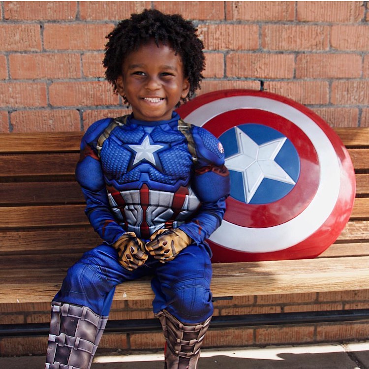 Kid wearing superhero halloween costume