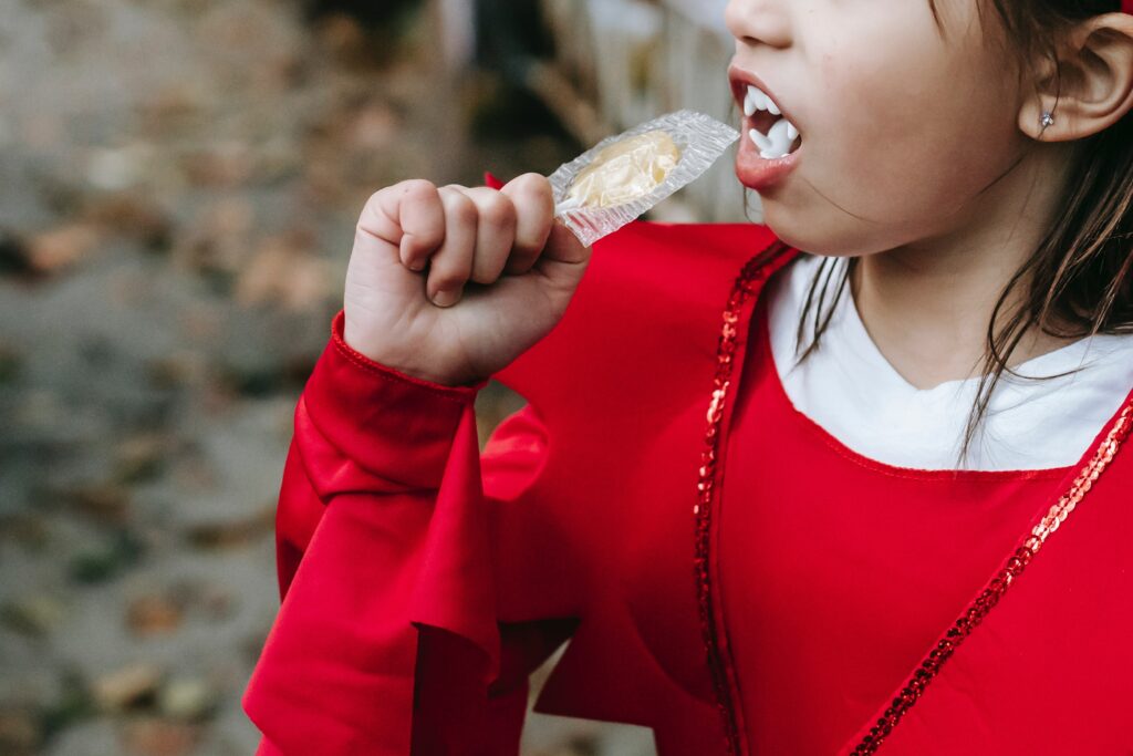 Kid eating halloween sugar candy
