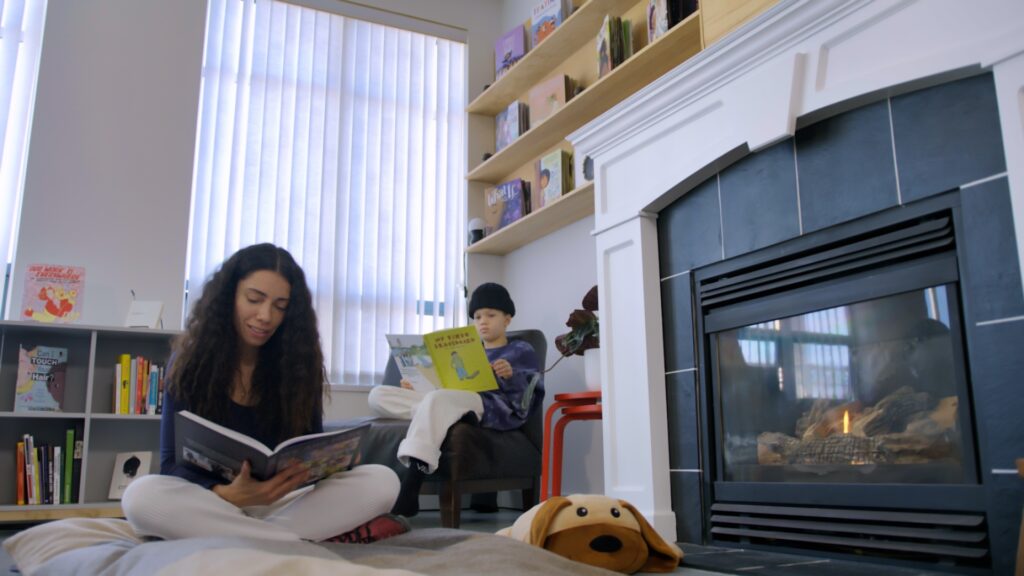 Reading together Aisha Kiani and son.