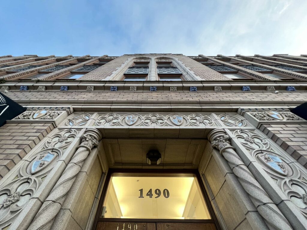 A picture of the VISST building from the address 1490up to a blue sky.