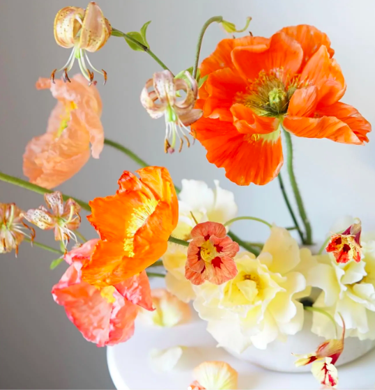 An arrangement of orange and yellow flowers
