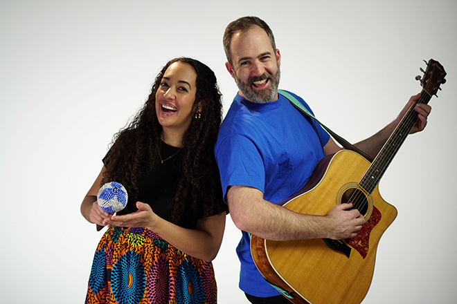 Will and Seeka, a man and a woman, pose and smile into the camera for the 2023 The Children's Festival.