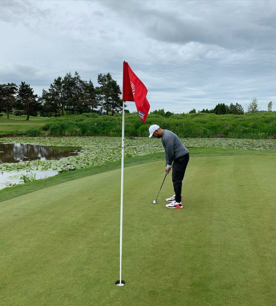 Man golfing on the green on Northview Golf Course in Surrey BC