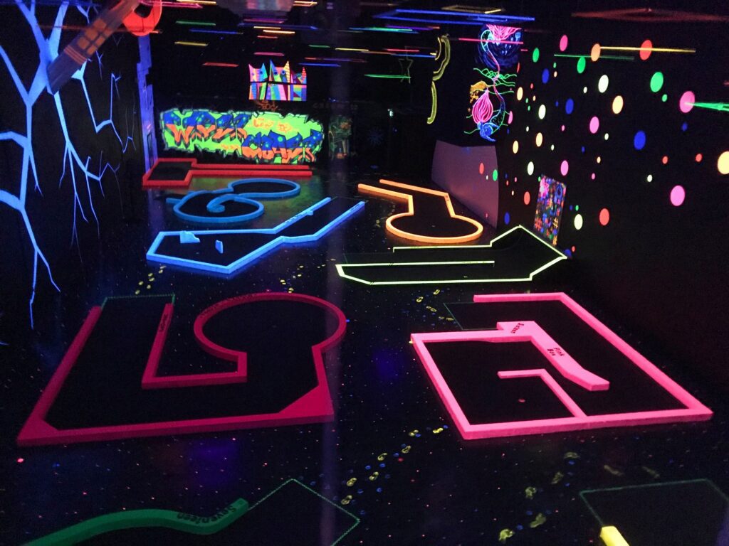 Night themed glow in the dark indoor mini golf