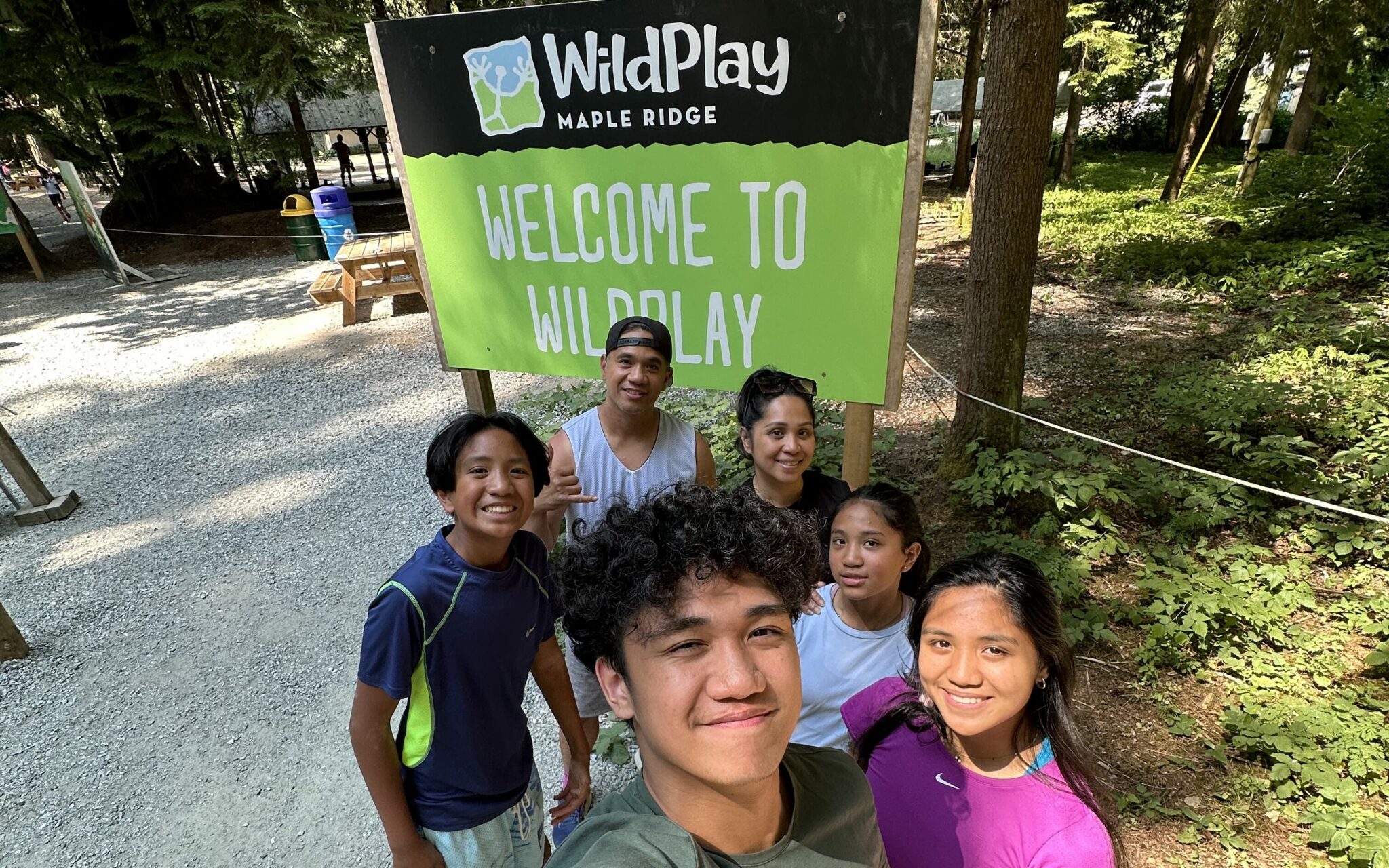 A family of 6 getting ready to soare amidst nature at the Wild Play Park Maple Ridge for an adventure