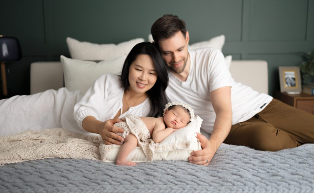 A couple and their baby in a family photoshoot done by a top Vancouver Family photographer