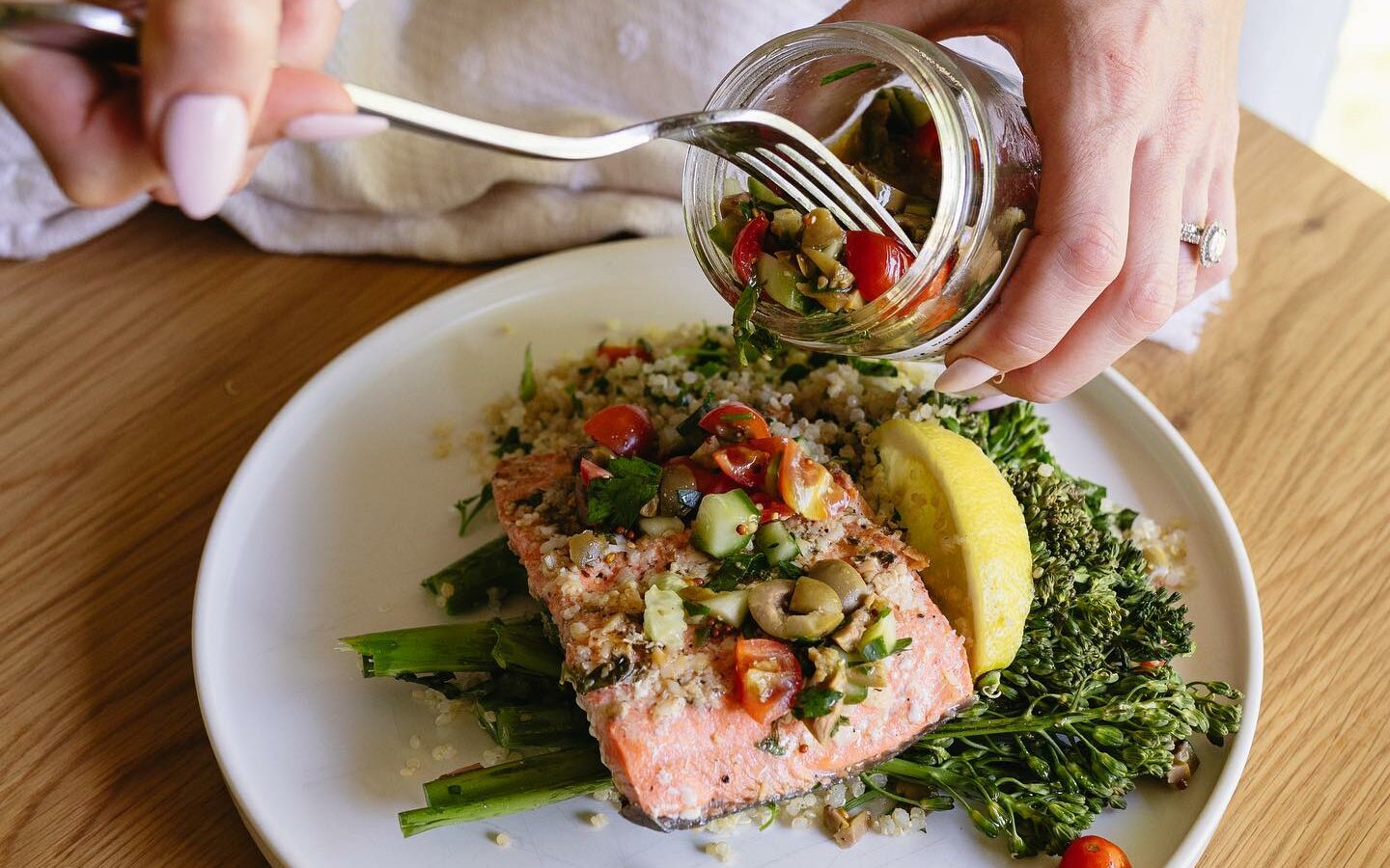 Salmon with a veggie medley on top of rice and broccoli from Fresh in your Fridge