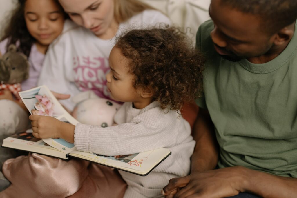a family looking at a photo album together