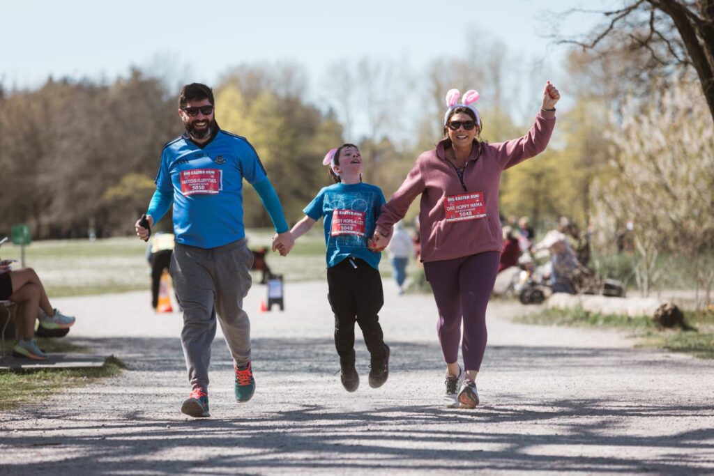 A family running together for the Big Fun Run series. Next run is the Big Jungle Run.