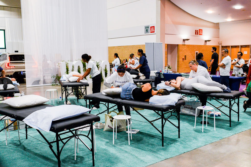 Parents getting a free massage at the Vancouver Baby Show