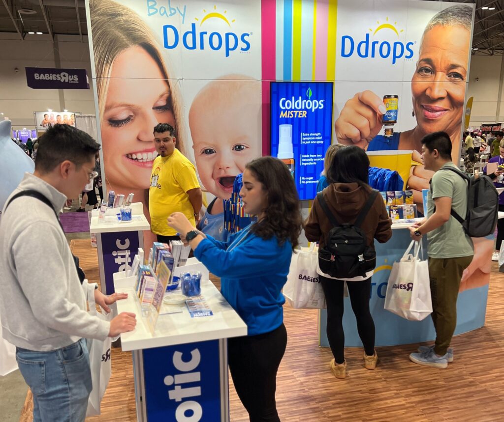 Parents at the Ddrops booth for the Vancouver Baby Show