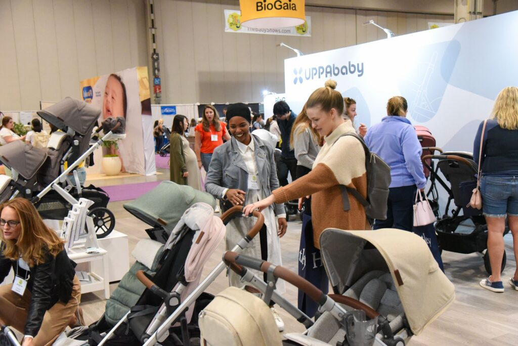 A group of moms looking at strollers at the Vancouver Baby Show