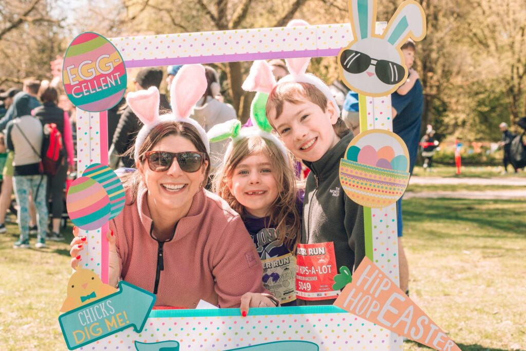 A mom and her 2 kids a posing for a picture for the Easter Fun Run