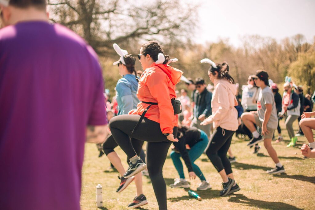 A group of runners warming up for a family fun run for the Easter fun run
