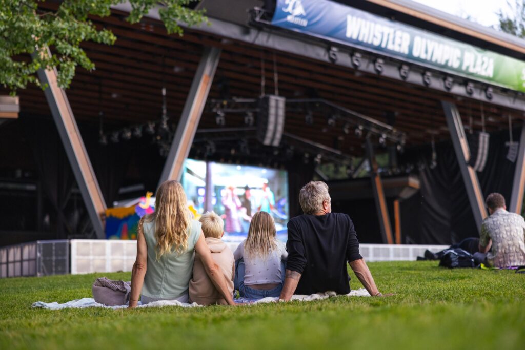 A family of 4 ready to watch a movie for the Whistler Children's Festival
